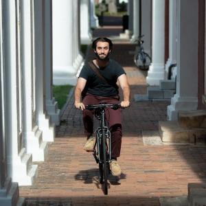 student riding a bike