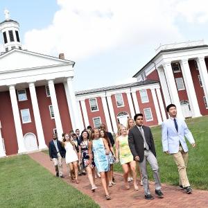 students walking in front of the colonnade